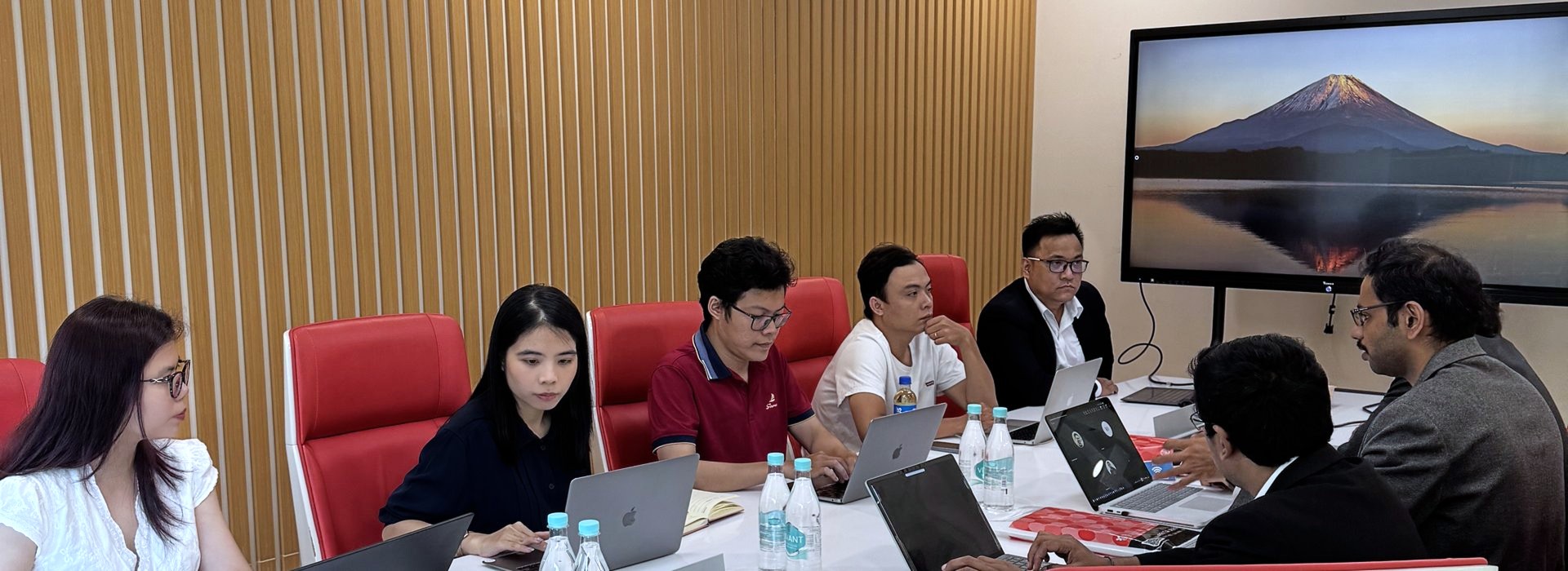 The team in a meeting around a table